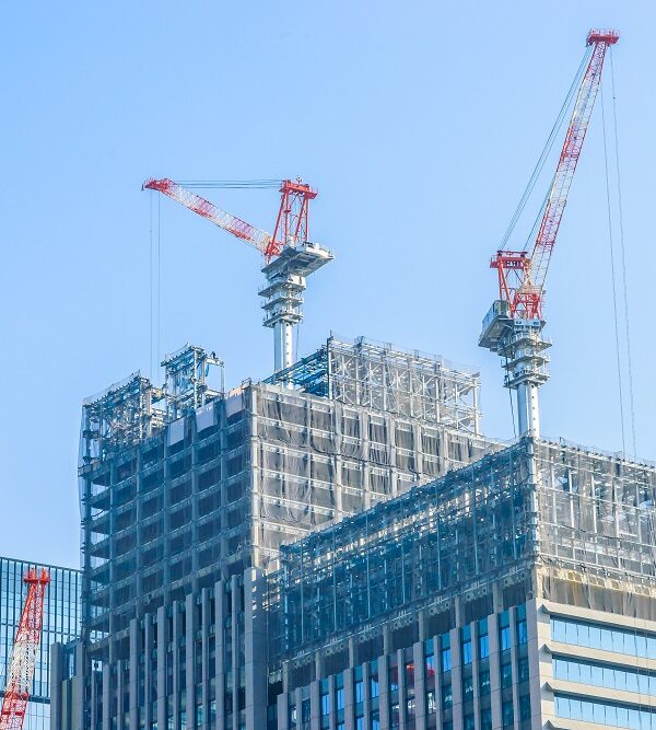 Crane construction building with blue sky background